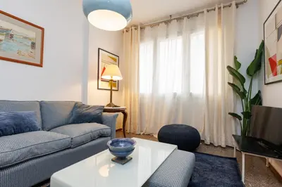 a living room with a couch and a table at Housalia Gracia 2 in Barcelona