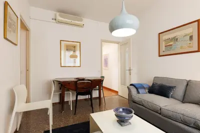 a living room with a table and a couch at Housalia Gracia 2 in Barcelona