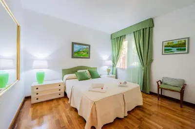 a bedroom with a bed and a table and a chair at Casa Farré next Barcelona Center in Pallejá