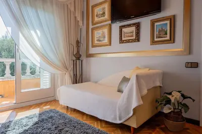 a living room with a bed and a window at Casa Farré next Barcelona Center in Pallejá