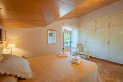 a bedroom with a large bed and a window at Casa Farré next Barcelona Center in Pallejá