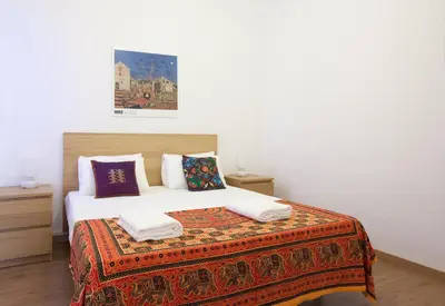 a bedroom with a large bed with pillows on it at Centric Apartment El Molino Theater p1 in Barcelona