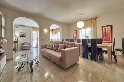 a living room with a couch and a table at Villa Soledad en Olivella, Sitges, Barcelona in Olivella