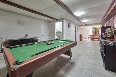 a living room with a pool table in it at Villa Soledad en Olivella, Sitges, Barcelona in Olivella