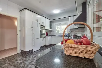 a basket of fruit on a counter in a kitchen at Villa Soledad en Olivella, Sitges, Barcelona in Olivella