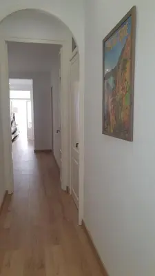 an empty hallway with a painting on the wall at Apartamento nuevo en Terrassa Centro in Terrassa
