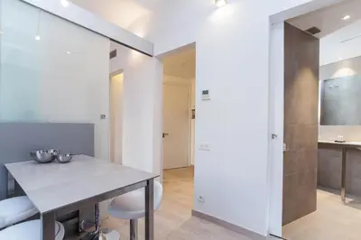a kitchen and dining room with a table and chairs at Housalia Sant Pau Views- Suite with View on Hospital Sant Pau in Barcelona