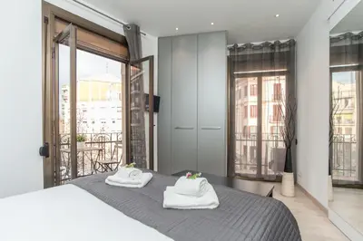 a bedroom with a bed with towels on it at Housalia Sant Pau Views- Suite with View on Hospital Sant Pau in Barcelona