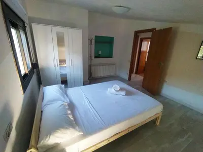 a bedroom with a bed with a towel on it at Villa Franz House Casa Principal in Canyelles