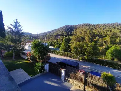 a balcony of a house with a view of a mountain at Villa Franz House Casa Principal in Canyelles