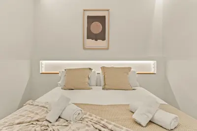 a bedroom with a bed with two pillows at Modern & stylish apartment in Barcelona in Barcelona
