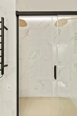 a shower with a glass door in a bathroom at Modern & stylish apartment in Barcelona in Barcelona