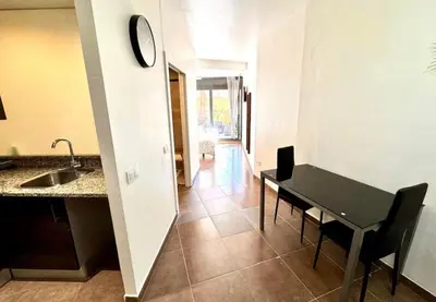 a bed in a room with a window and a tv at MT Boutique Suites y Apartamentos - Adults Only - in Mataró