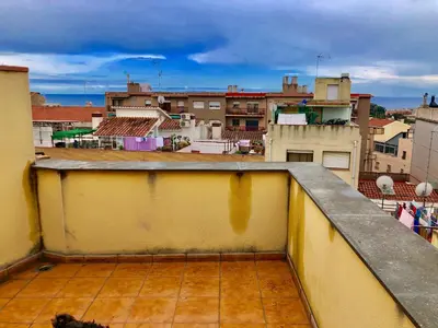 a room with a bed and a table in it at MT Boutique Suites y Apartamentos - Adults Only - in Mataró