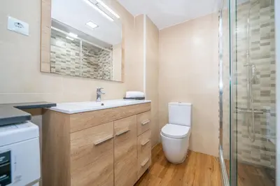 a bathroom with a toilet and a sink and a shower at HomeHolidaysRentals Deva - Costa Barcelona in Pineda de Mar