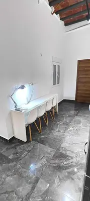 a room with a table with chairs and a lamp at Beautiful Appartment in Martorell (Barcelona) in Martorell