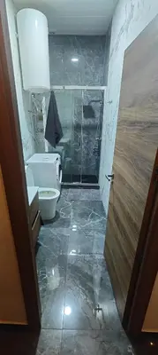 a bathroom with a shower and a toilet and a sink at Beautiful Appartment in Martorell (Barcelona) in Martorell