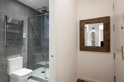 a bathroom with a toilet and a shower at Charming Parallel in Barcelona