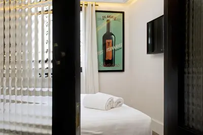 a room with a picture of a bottle of wine at Praktik Vinoteca in Barcelona