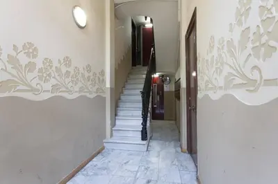 a hallway with stairs in a building at Bright & Spacious Family Flat in Central Barcelona in Barcelona