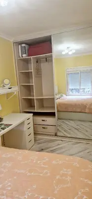 a bedroom with a mirror and a desk and a bed at Sweet home in Sant Adria de Besos