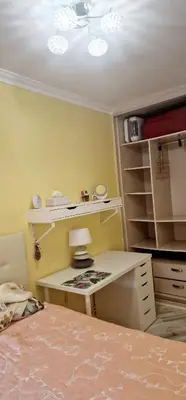 a bedroom with a desk with a lamp and a bed at Sweet home in Sant Adria de Besos