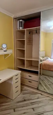 a bedroom with a closet with a mirror and a bed at Sweet home in Sant Adria de Besos