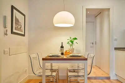 a dining room with a table and chairs at Catalan Comfort near Sagrada Familia by MyRentalHost in Barcelona