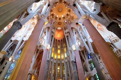 a view of the ceiling of a church at Catalan Comfort near Sagrada Familia by MyRentalHost in Barcelona