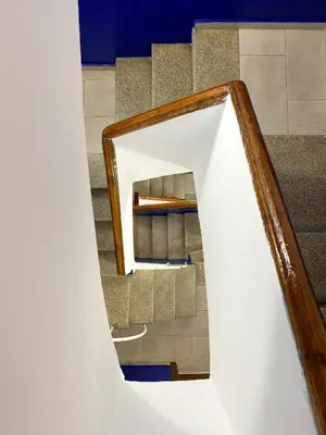 a stairway with a mirror on the side at MarBarcelona Apartments Mas in Hospitalet de Llobregat