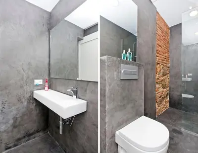 a bathroom with a white sink and a toilet at Roós, design loft near the sea. in Barcelona