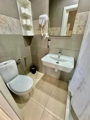 a bathroom with a toilet and a sink at Nuevos Apartamentos frente al mar y a la playa in Castelldefels