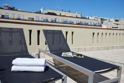a table with two towels on top of a building at AB Paral·lel Spacious Apartments in Barcelona