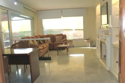 a large living room with couches and a table at MAGNÍFICA RESIDENCIA in Masnou