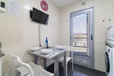 a small dining room with a table and chairs at Fira Suites - Habitaciones privadas en Apartamento compartido in Hospitalet de Llobregat