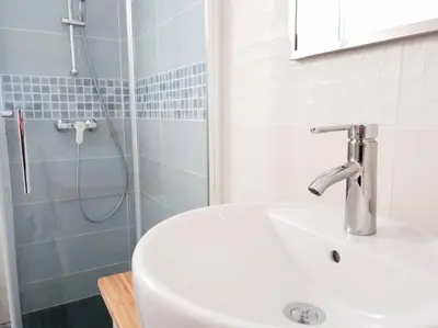 a bathroom with a sink and a shower at Hola! - Sitges Centric Apartment in Sitges