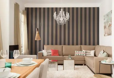 a living room with a couch and a table at Click&Flat Seneca Suites in Barcelona
