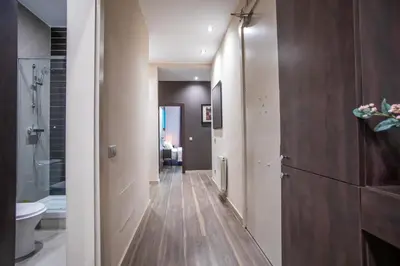 a hallway leading to a bathroom with a toilet at Tendency Apartments 9 in Barcelona