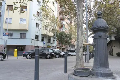 a fire hydrant on the side of a city street at Apartment Marti in Barcelona
