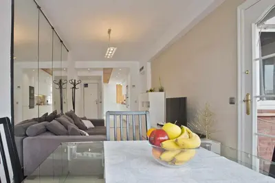 a bowl of fruit on a table in a living room at Apartment Marti in Barcelona