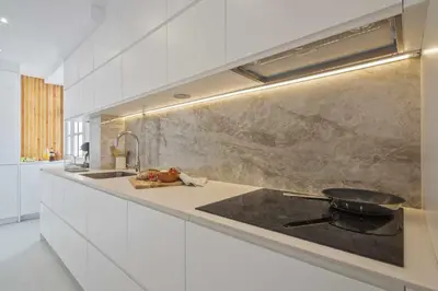 a kitchen with a stove and a counter top at Apartment Marti in Barcelona