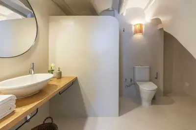 a bathroom with a sink and a toilet at Finca Can Romeu: alojamiento rural entre viñedos in Font-Rubí