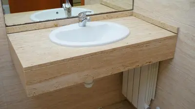 a bathroom counter with a sink and a mirror at MarBarcelona Suites Berlin in Barcelona