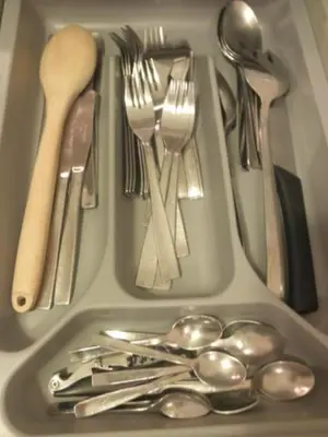 a tray filled with silver utensils and spoons at Piquer con Terraza in Barcelona