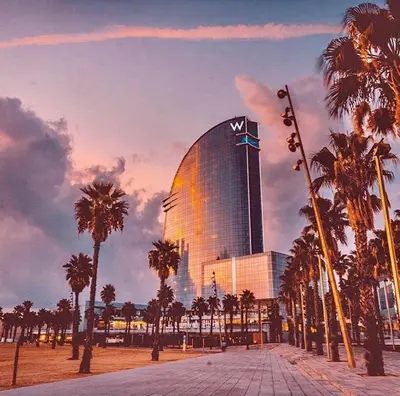 a large building with palm trees in front of it at Quiet apartment! Sagrada Familia! in Barcelona