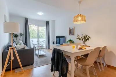 a living room with a table and a couch at 4207 - AB Sant Adria de Besos in Sant Adria de Besos