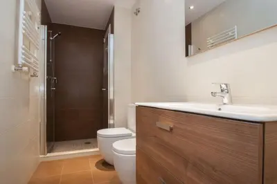 a bathroom with a toilet and a sink and a shower at Autèntic Barcelona Monumental in Barcelona