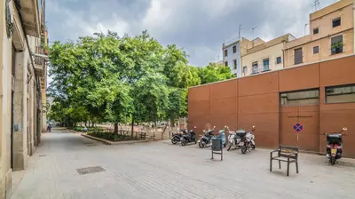 a group of motorcycles parked next to a building at Welcomy Born in Barcelona