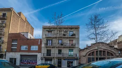 a building on a city street with buildings at Welcomy Poblenou II in Barcelona