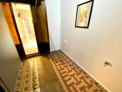 a hallway with a tile floor next to a door at Apartamento de 3 habitaciones en Sants a 2`del metro Badal P9 in Barcelona